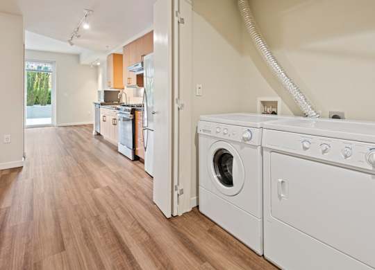 In unit washer and dryer in closet at Axis Seattle Apartments, Seattle