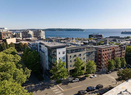 Aerial view of residential buildings and waterfront at Axis Seattle Apartments, Washington, 98109