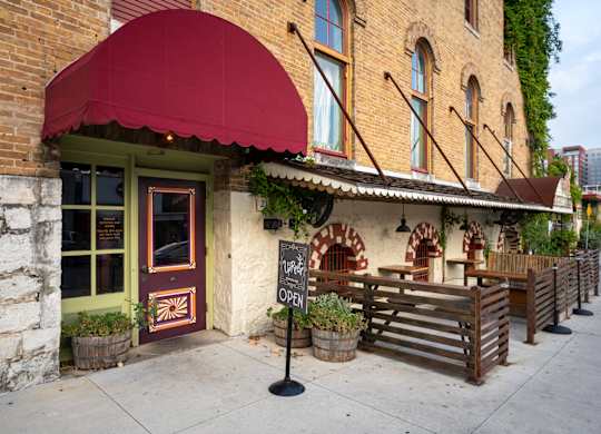 A building with a red awning in San Marcos Texas
