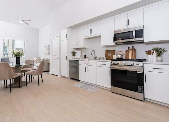Living room with Kitchen with stainless steel appliances