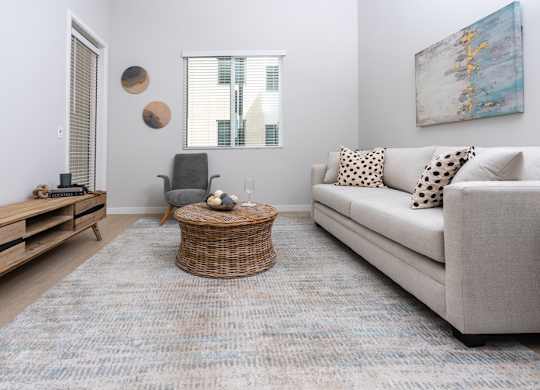 Living room with window, couch and coffee table