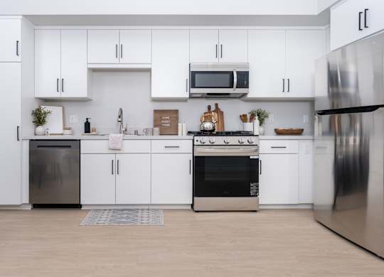 Kitchen with white cabinets and stainless steel appliances