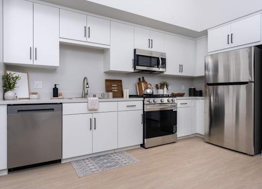 Kitchen with white cabinet and stainless steel appliances