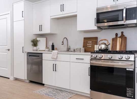Kitchen with white cabinets and stainless steel appliances