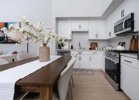 Kitchen with white cabinets and stainless steel appliances