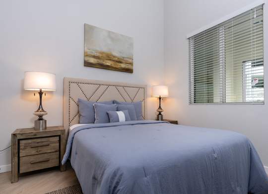 Bedroom with nightstand and windows