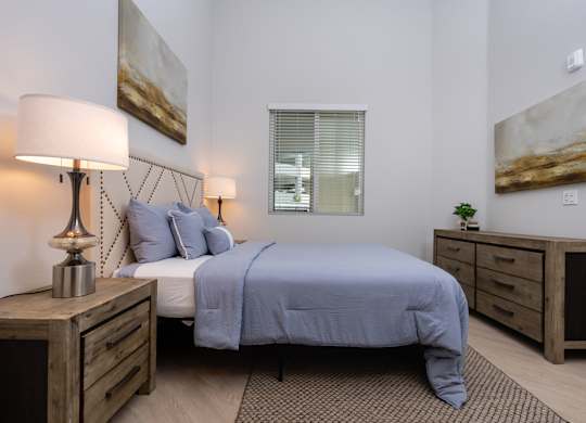Bedroom with window and painting