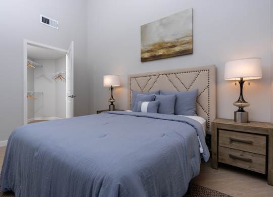 Bedroom with painting on the wall