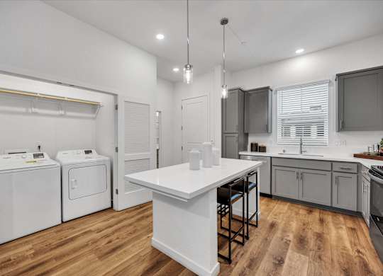 Kitchen with Small Laundry Area at Estia Roseville Apartments, Roseville