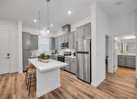 Kitchens With High-Quality Countertops at Estia Roseville Apartments, Roseville, California
