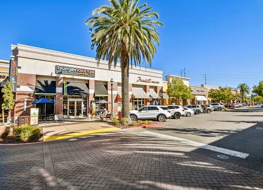 A Burger Lounge is located in a strip mall.