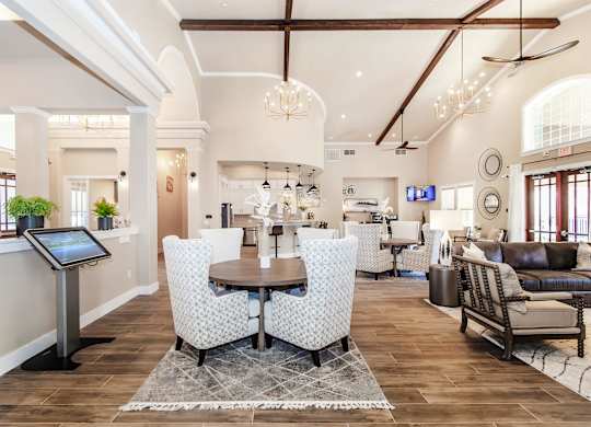 A modern living room with a dining table and chairs.