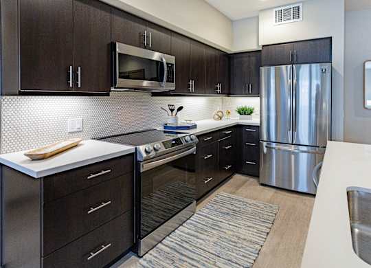 furnished kitchen with stainless steel appliances at Bayswater Apartments, Burlingame, CA