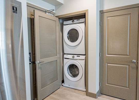 Stackable In-Unit Full-Size Front-Loading Washer And Dryer In Closet at Bayswater Apartments, Burlingame, 94010