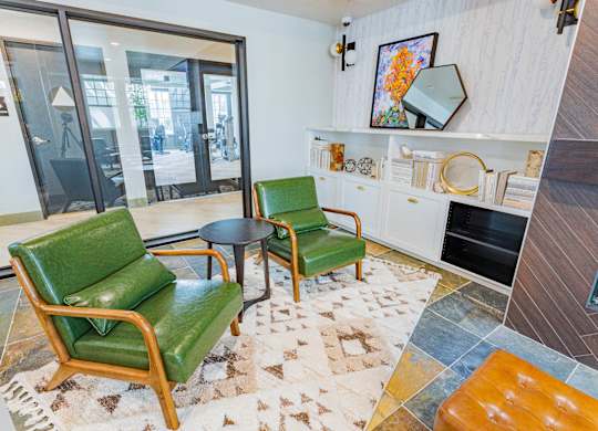 resident lounge with lounge chairs at Bayswater Apartments, Burlingame