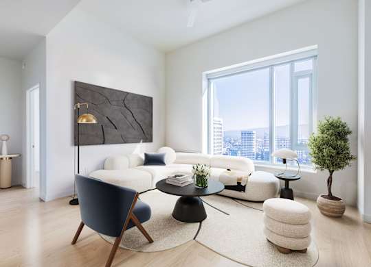 A modern living room with a large window overlooking the city.