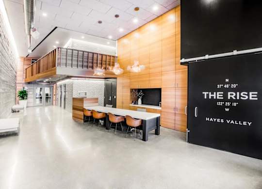 A modern office space with a long table and chairs at The Rise, San Francisco, 94103  