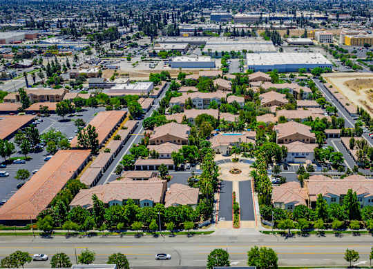 A bird's eye view of a residential area with a central square.