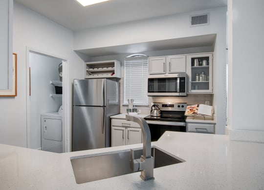 Kitchen With White Cabinetry And Appliances at Silverado, Frisco