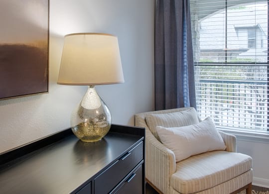 Bedroom sitting area near window at Silverado, Frisco, TX