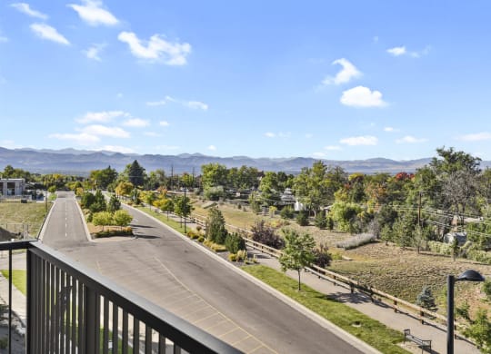 the view from the balcony overlooking the street and mountains at Parkside at Littleton Village, Littleton, Colorado