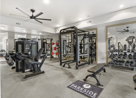 a home gym with weights and cardio machines and a ceiling fan at Parkside at Littleton Village, Colorado