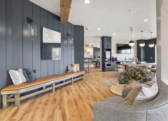 a living room with a couch and a table and a kitchen at Parkside at Littleton Village, Colorado