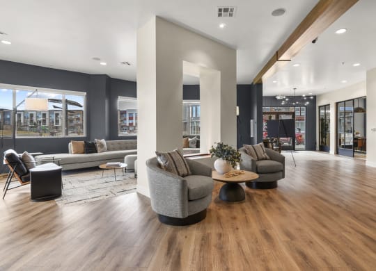 a living room with couches and chairs on a wood floor at Parkside at Littleton Village, Littleton, Colorado