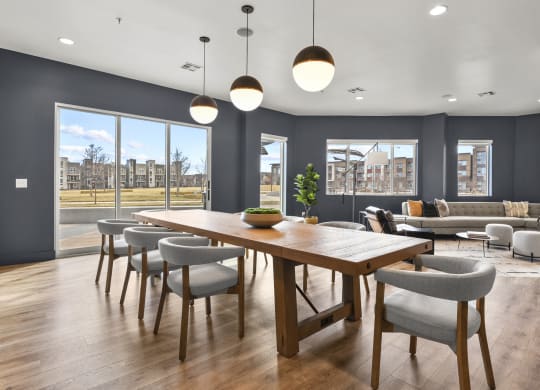 a dining room with a wooden table and chairs at Parkside at Littleton Village, Littleton, 80122
