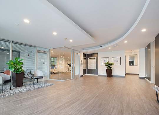 A spacious office with wood floors and a curved ceiling.at Plaza Lafayette, Los Angeles, CA  