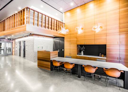 A modern office space with a long table and chairs.at The Rise, San Francisco, 94103  