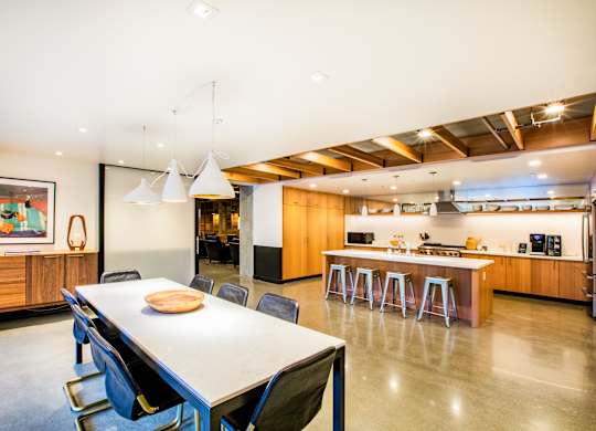 A modern kitchen with a dining table and chairs.at The Rise, San Francisco, 94103  