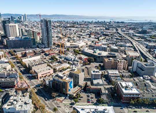 A cityscape with buildings, roads, and a construction site.at The Rise, San Francisco California  