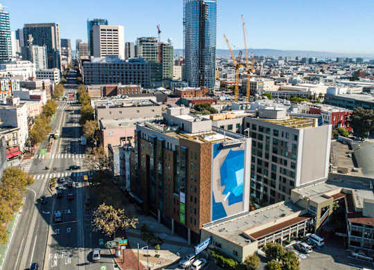 A cityscape with a large building under construction in the foreground.at The Rise, San Francisco, CA 94103  