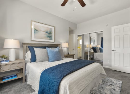 a bedroom with a bed and a ceiling fan at Vaseo Apartments, Phoenix, AZ 85022