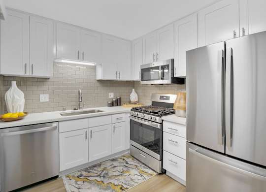 A modern kitchen with stainless steel appliances at Verandas Apartments, California