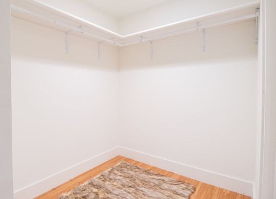 A room with a rug on the floor and a white wall at Woodley Sara Apartment, Van Nuys, CA