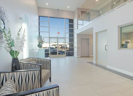 A living room with a zebra print sofa and a glass table at Woodley Sara Apartment, Van Nuys, 91406