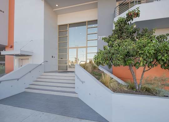 A modern house with a tree in front of it at Woodley Sara Apartment, Van Nuys, CA