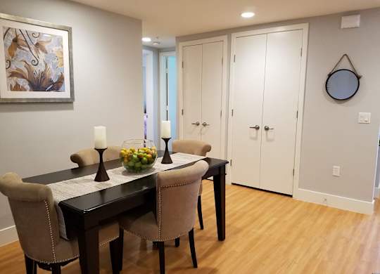 A dining room with a table set for two at Woodley Sara Apartment, California