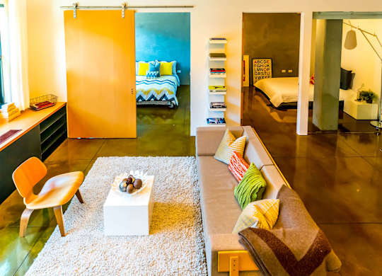 A living room with a couch, chair, and a coffee table.