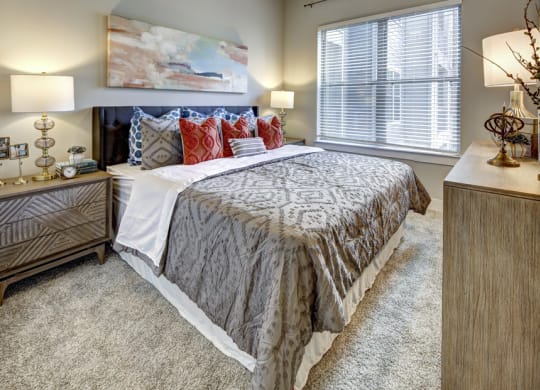 a bedroom with a bed and a window at Arise Riverside, Austin, 78741