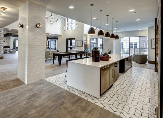 a large kitchen with a large island and a dining room at Arise Riverside, Austin, TX