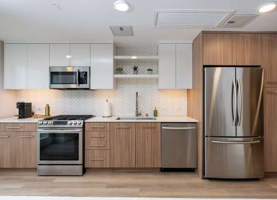 A modern kitchen with a stainless steel refrigerator.