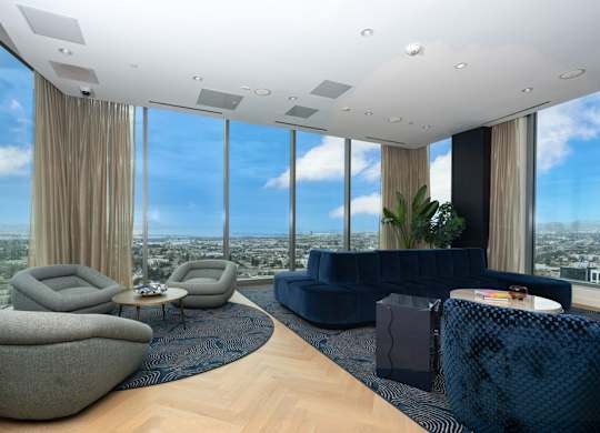 A modern living room with a view of the city.