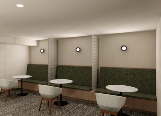 Shared lounge area with booth seating and tables at Axis Seattle Apartments, Seattle, WA