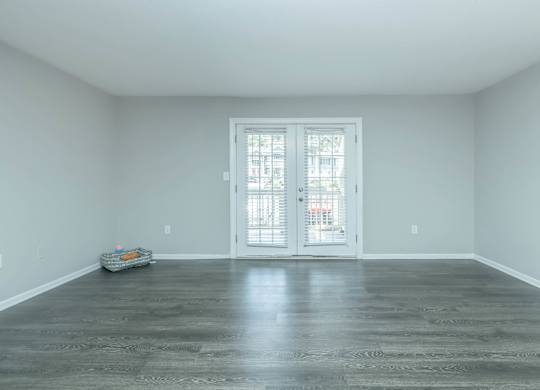 A room with a door and a trolley on the floor at Crest at East Cobb Apartments, Marietta, Georgia