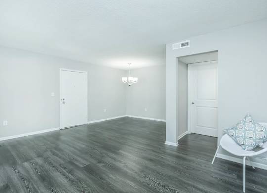 A room with a chair and a pillow on it at Crest at East Cobb Apartments, Marietta, GA