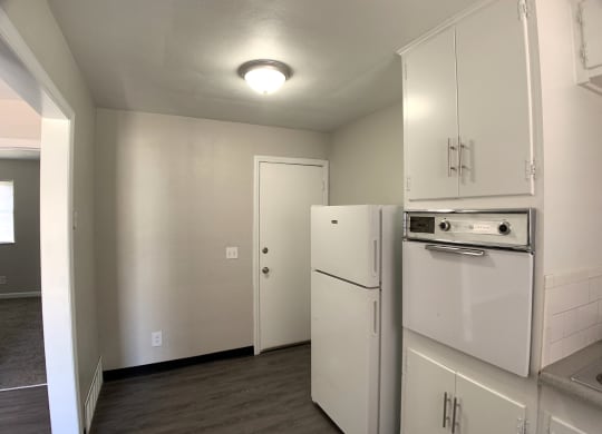 Kitchen with spacious cabinetry and white appliances