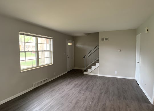 Spacious living room with vinyl flooring  and big window
